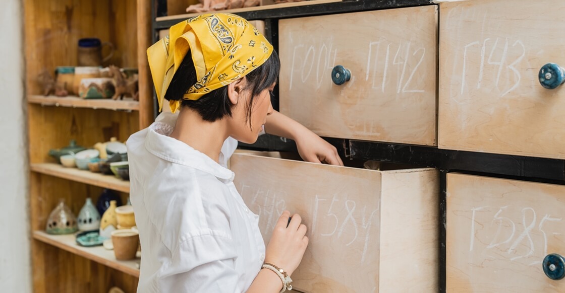 Young artist storing art supplies