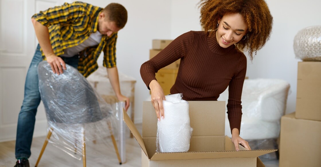 Happy couple packing beginnings for long term storage.